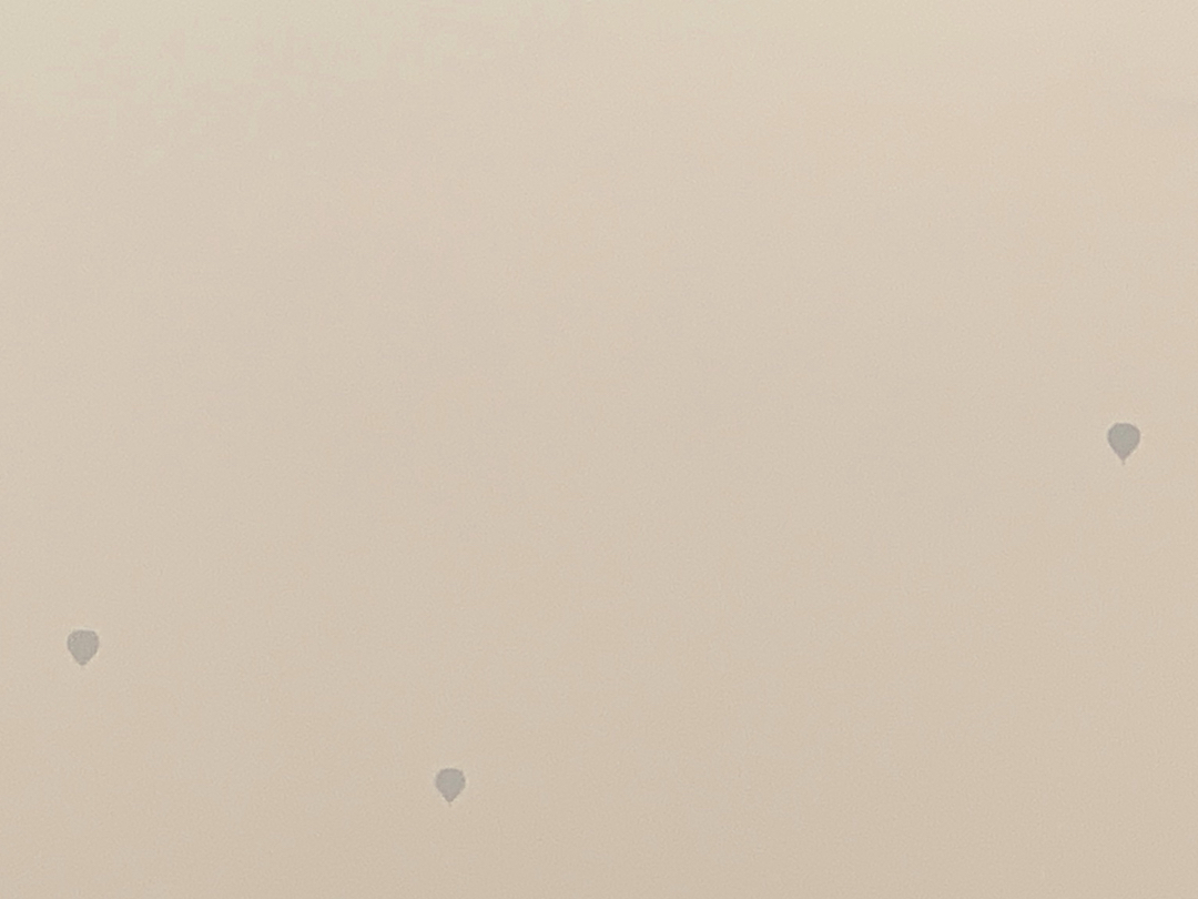 Hot air balloons through wildfire haze