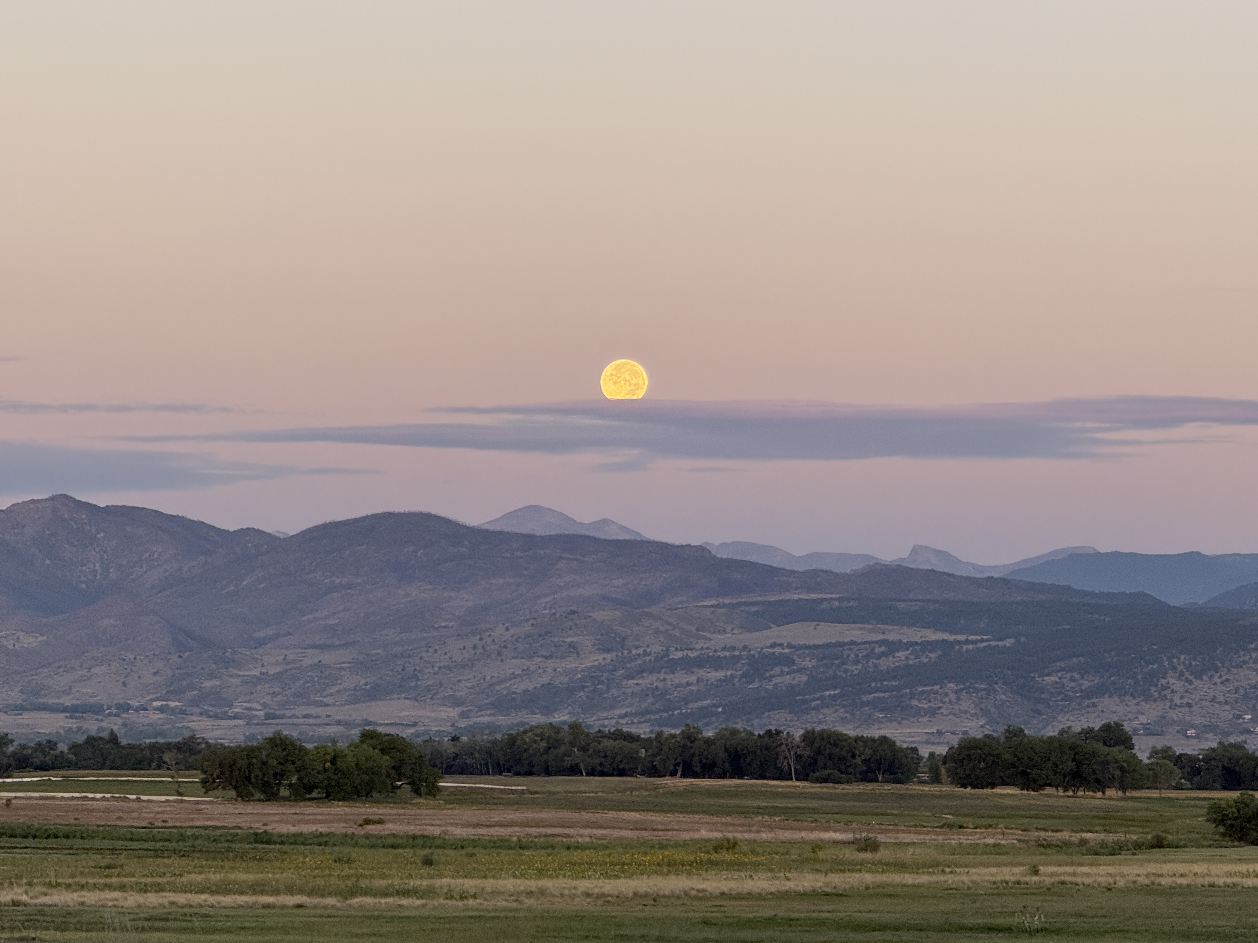 Moon setting through clouds over the Front Range