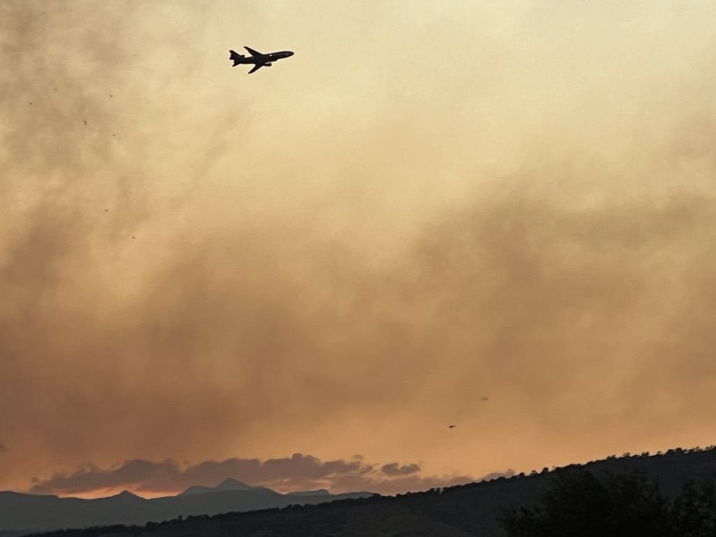 Slurry bomber taking a pass over the Stone Canyon fire