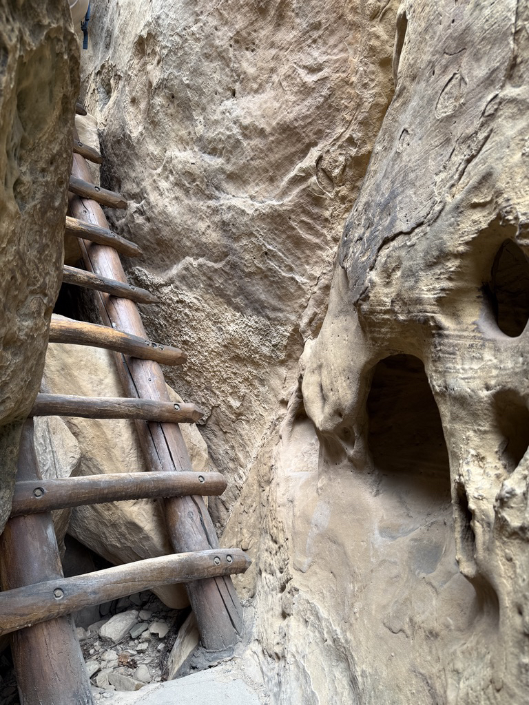 The Ancestral Puebloans would have used hand and foot holds in the rocks, not a ladder