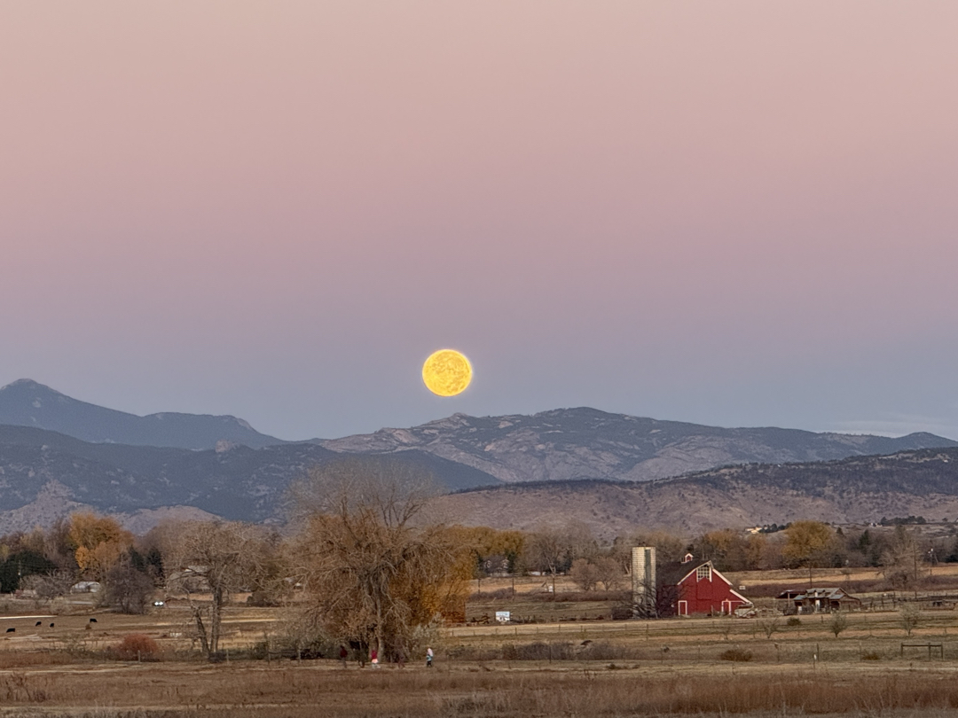Beaver Supermoon setting over the Front Range